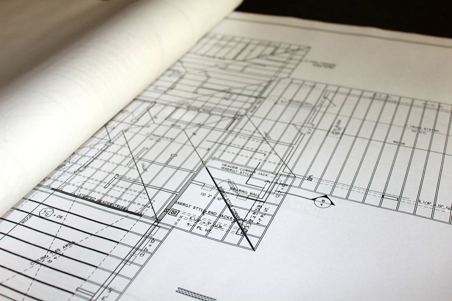 Hands reviewing a building design
