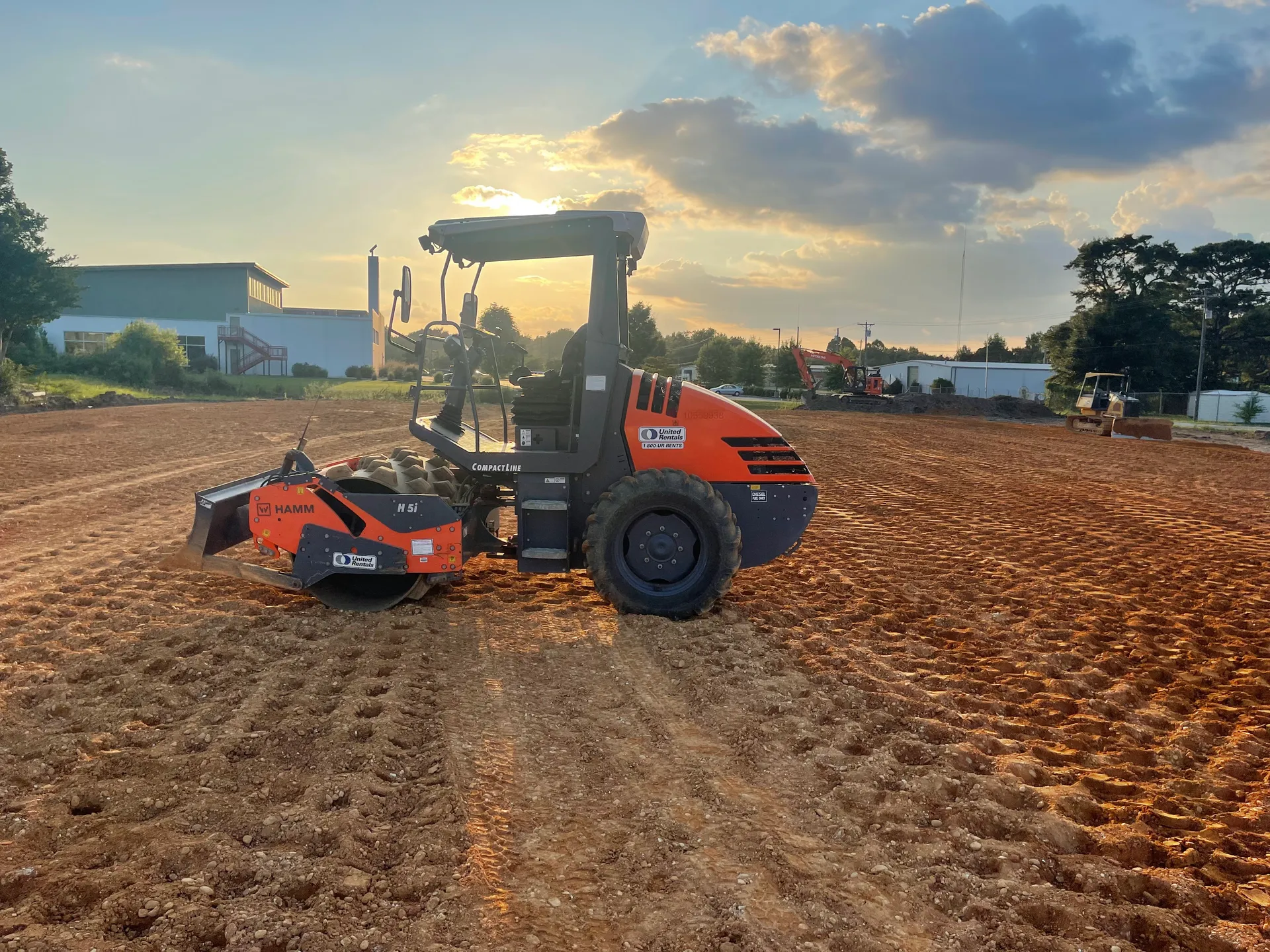 Heavy equipment preparing a commercial construction site